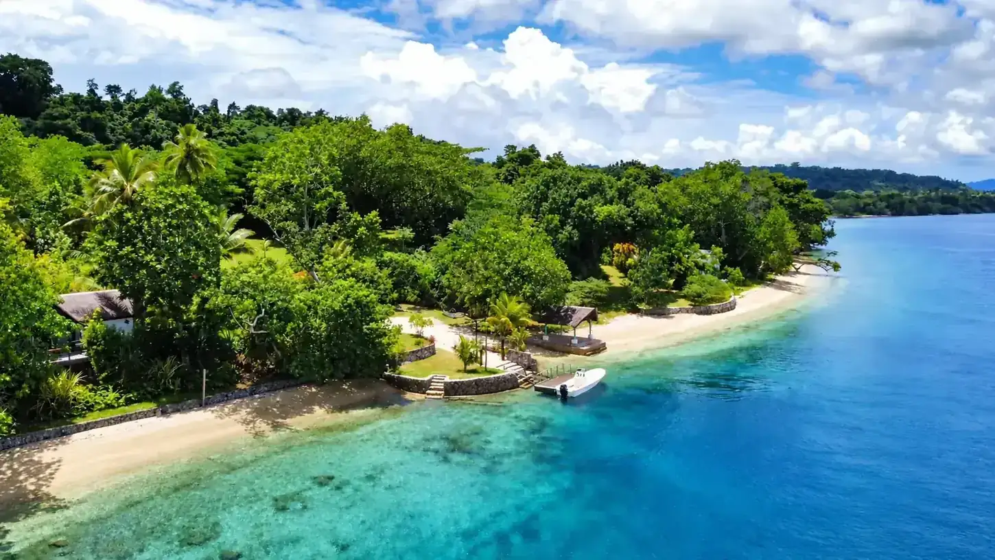 Aerial view of Freshwater Plantation tropical shoreline and turquoise Segond Channel